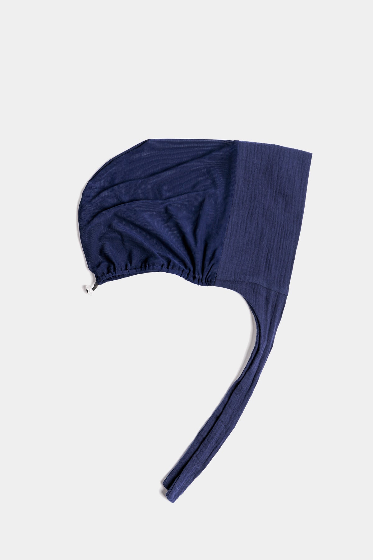 a navy blue textured  cotton mesh underscarf  with ties shown flat against a light gray background.
